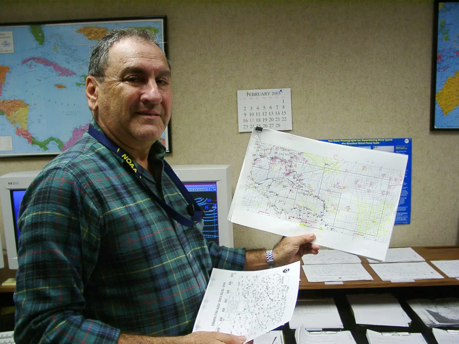 NHC meterologist using highlighter to analyze weather patterns, NHC 2003