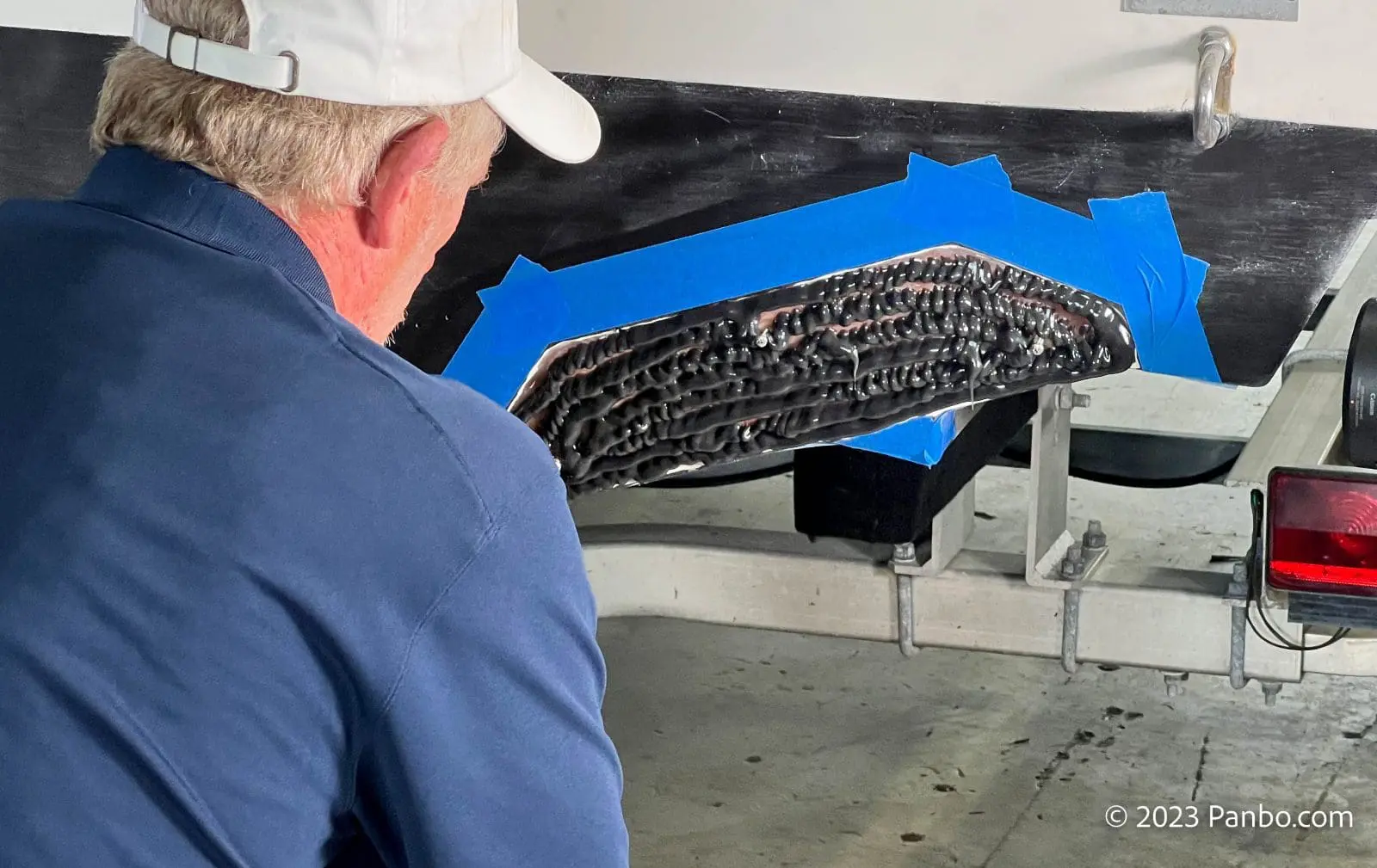 The transom has been ground down to fiberglass and covered in adhesive to receive the Ride controller