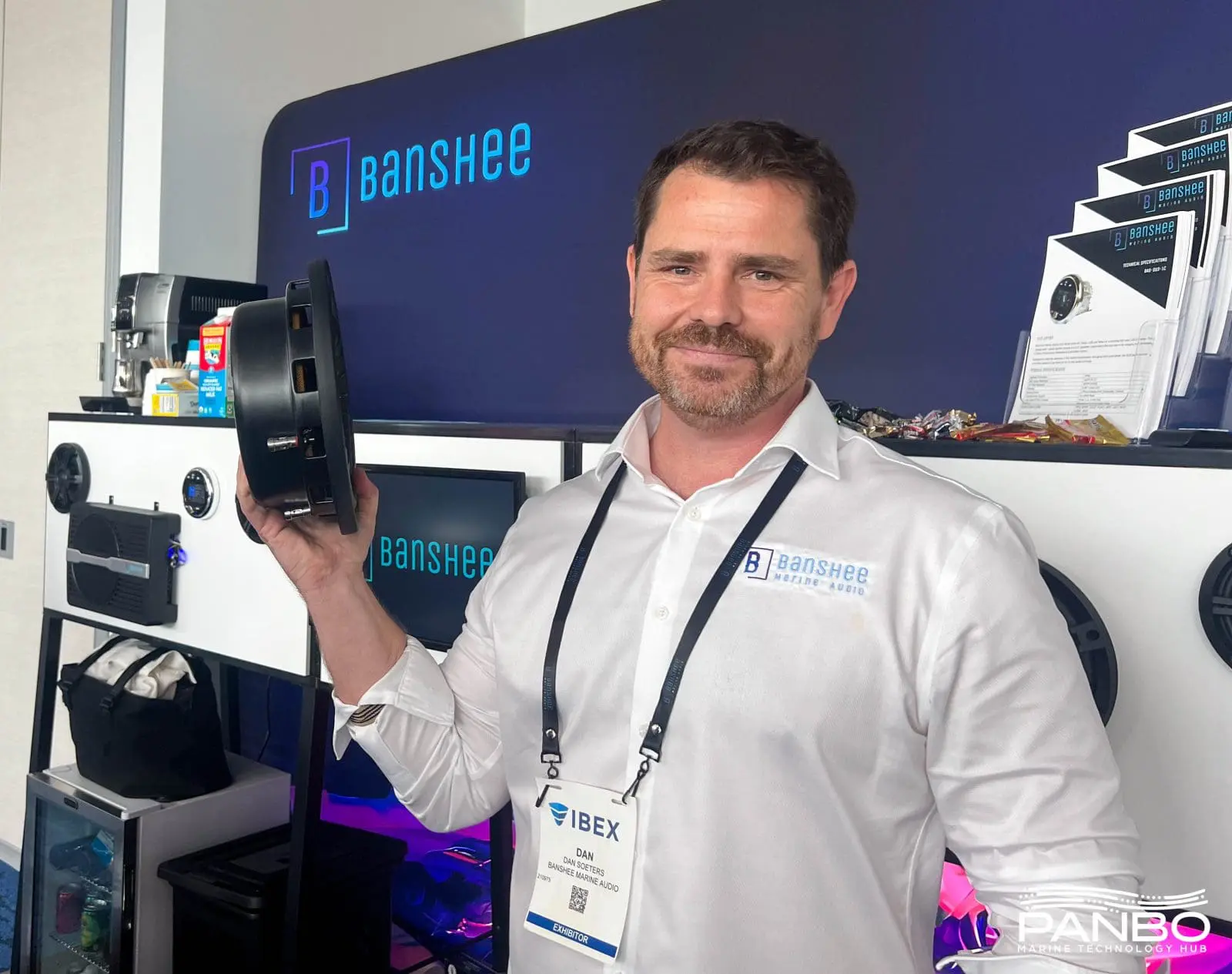 Banshee Marine Audio founder Dan Soeters holding one of his (surprisingly heavy) subwoofers