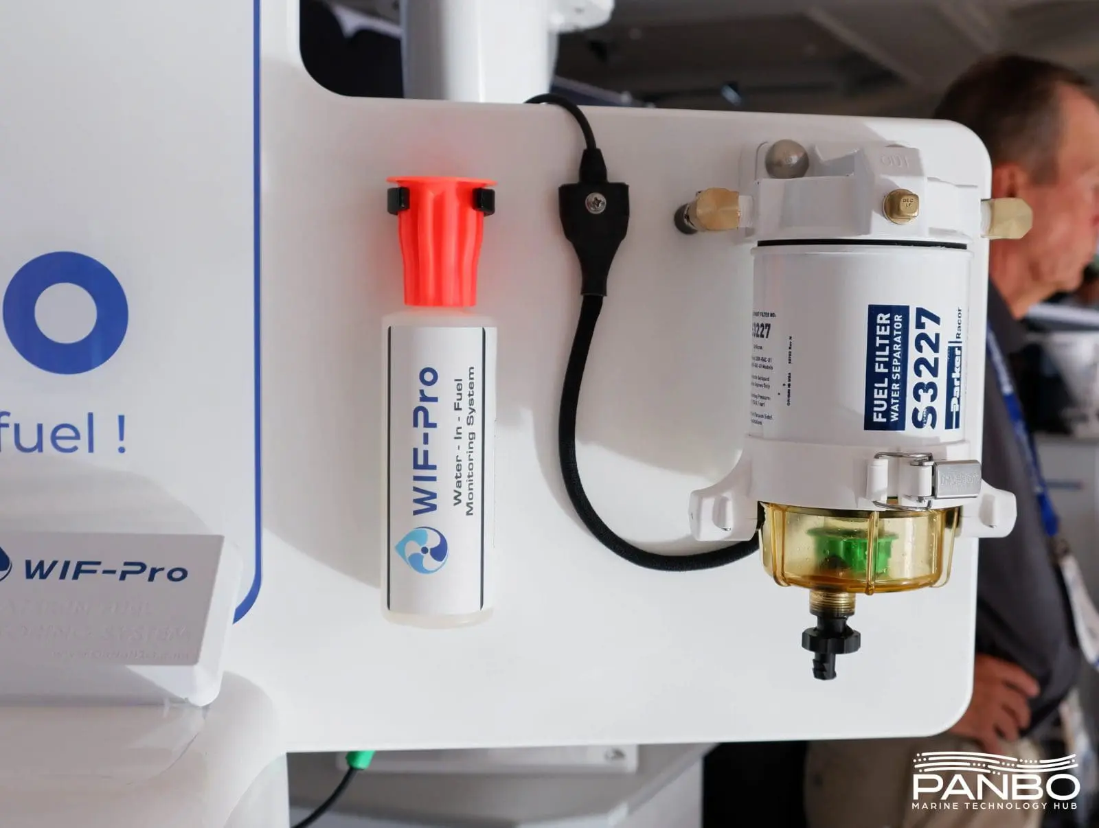The WIF-Pro system installed on a filter with their very clever drain bottle next to it