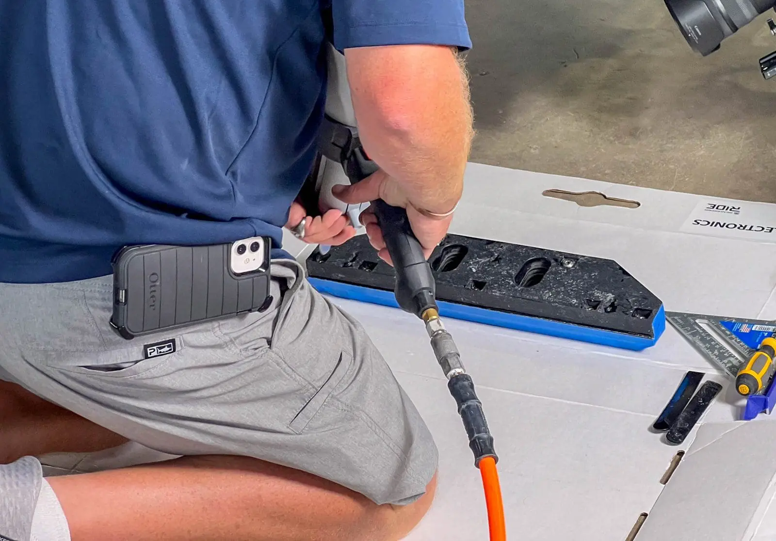 Adhesive being applied to the blade housing