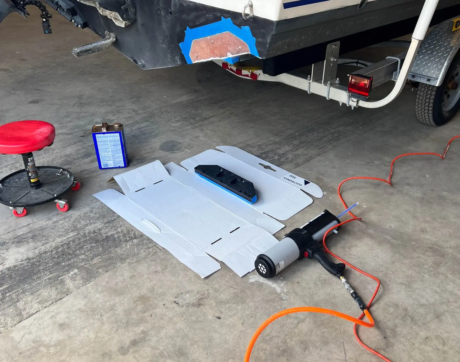 The impressive, pneumatic gun used to apply the adhesive